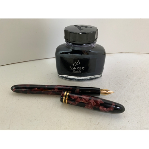 845 - Fountain Pen and Bottle of Ink