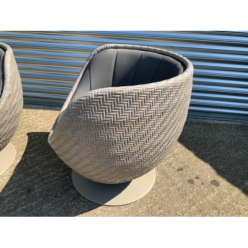 127 - Rattan Garden Swivel Chairs