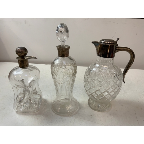 860 - 3x Silver Topped Decanters