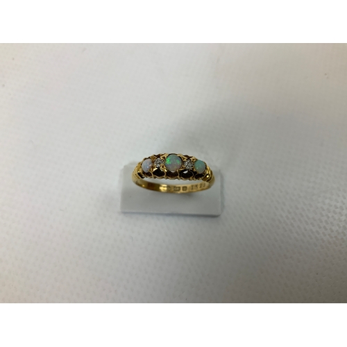 58 - 18ct Gold Opal and Diamond Ring - Size M