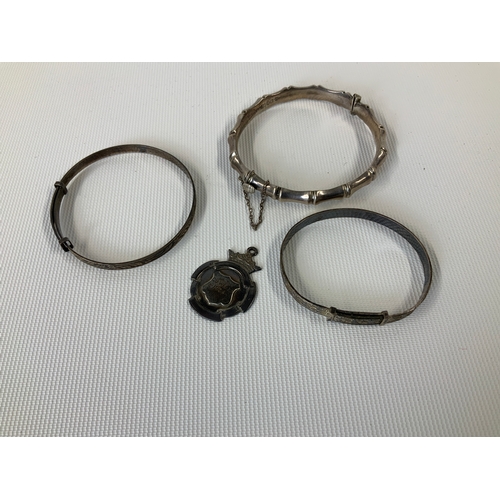 123 - Silver Bangles and Medal