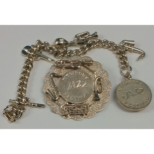 233 - Collection of Jazz five keyrings one Newport Jazz Festival Badge & Charm bracelet and Award