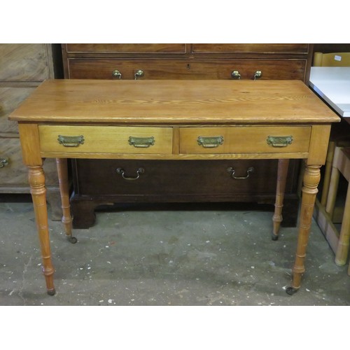 98 - Early 20th century oak two drawer side table. Approx. 76cm H x 107cm W x 50cm D