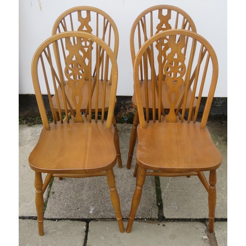 105 - Set of four mid 20th century ercol style wheelback chairs. Approx. 89cm High