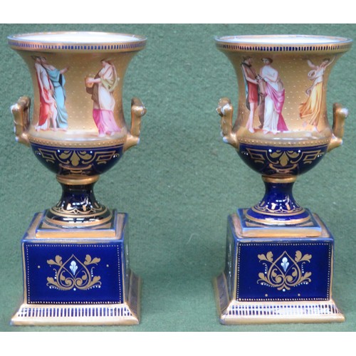 16 - Pair of Vienna pottery heavily gilded and cobalt blue ceramic urns, handpainted with classical figur... 