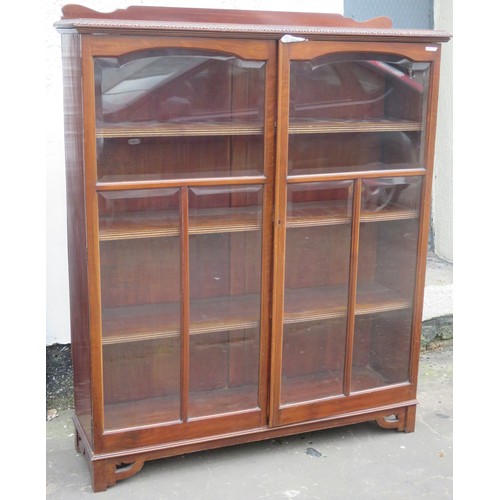 7 - Victorian mahogany two door glazed bookcase, with piecrust edge. Approximately. 145cm H x 119cm W x ... 