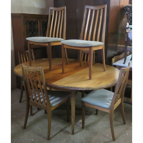 5 - Mid 20th century G Plan teak circular extending dining table, plus six chairs. Approximately. 72cm H... 