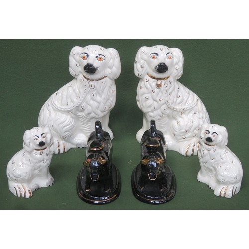 83 - Two pairs of stafordshire style ceramic spaniels, smaller pair stamped Beswick, plus pair of victori... 