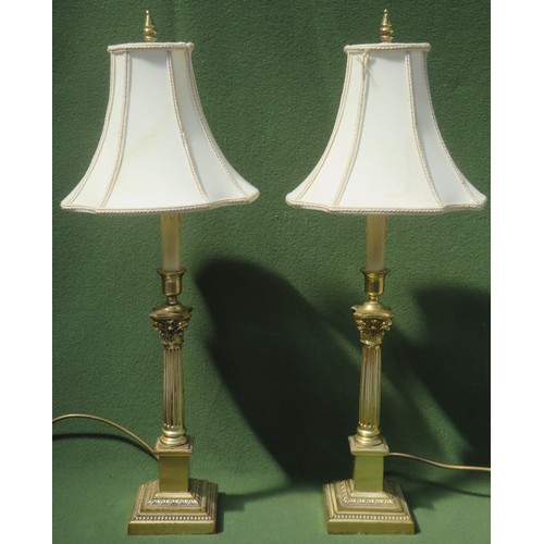 90 - Pair of 20th century brass column form table lamps, with shades. lamp bases measure Approx. 49.5cms ... 