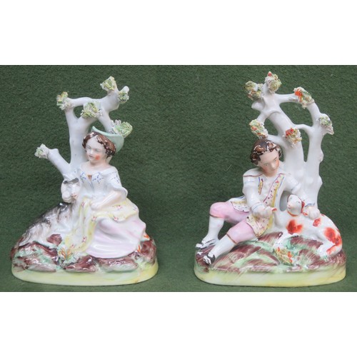 103 - Pair of 19th century Staffordshire hand painted figure groups, depicting recumbent figures and dogs.... 