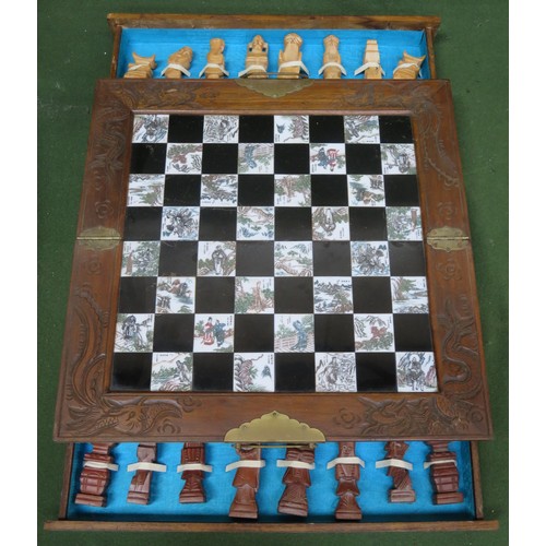 64 - Oriental carved chess board with pieces