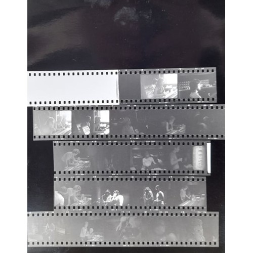 384 - Five contact sheets of photographs of unknown band with corresponding negatives