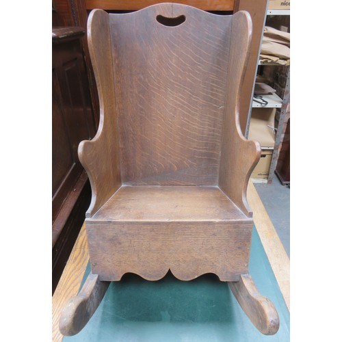 210 - Childs antique oak rocking chair. Approximately. 58cm H x 34cm W