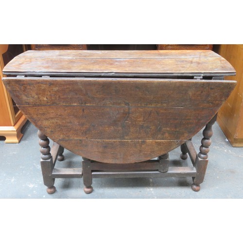 213 - RTV - Early Antique Oak gateleg dining table on bobbin supports. Approximately. 71cm H x 106cm W x 1... 