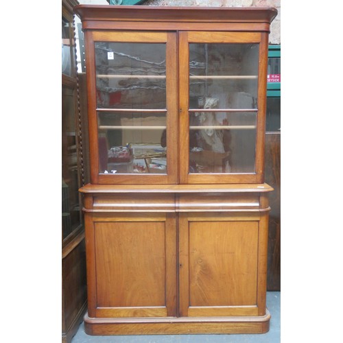 221 - Victorian mahogany two door glazed bookcase, fitted with two drawers and cupboard doors below. Appro... 