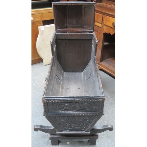 224 - RTV - 19th century heavily carved oak Jacobian style cradle, with hinged canopy, on stand. Approxima... 