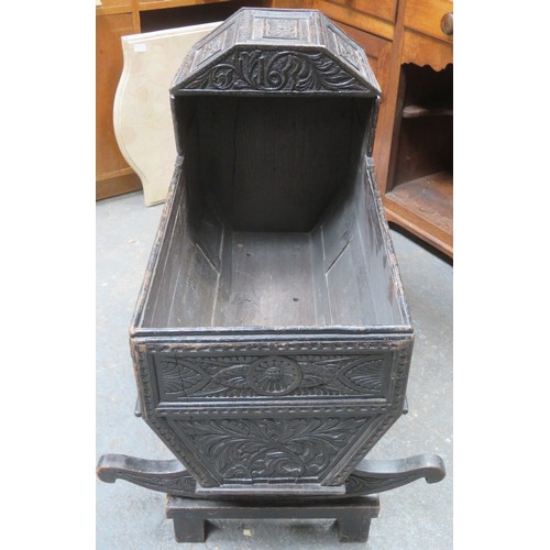 224 - RTV - 19th century heavily carved oak Jacobian style cradle, with hinged canopy, on stand. Approxima... 