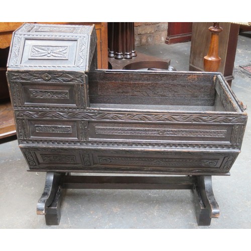 224 - RTV - 19th century heavily carved oak Jacobian style cradle, with hinged canopy, on stand. Approxima... 