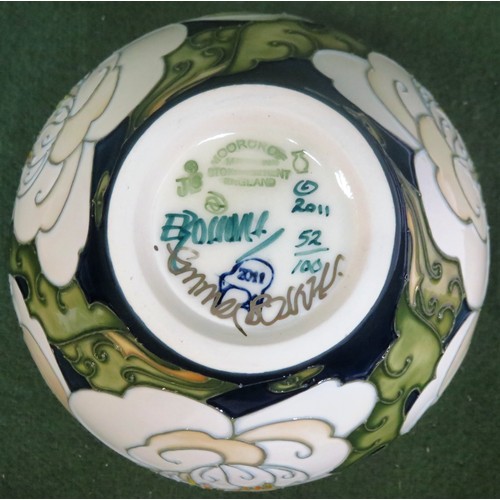 26 - Moorcroft limited edition tube lined and glazed ceramic 'Camellia' pattern vase, signed to base by E... 