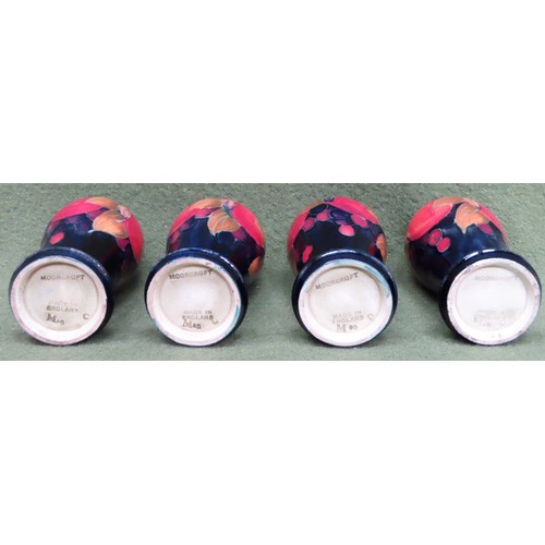 6 - Set of four Moorcroft tube lined 'Pomegranate' pattern glazed ceramic vases, all stamped 'M45'. Appr... 