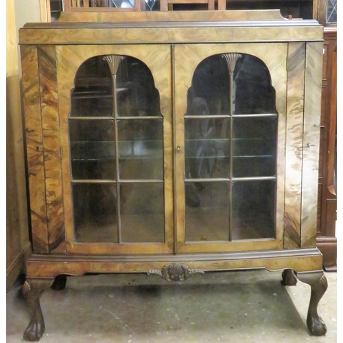 31 - Early 20th century walnut veneered bow fronted two door glazed display cabinet with hinged side comp... 