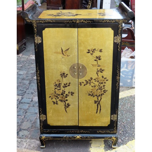 166 - 20th century Oriental black lacquered two door side cabinet, with gilded decoration throughout. Appr... 