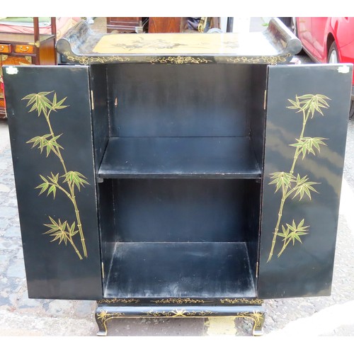 166 - 20th century Oriental black lacquered two door side cabinet, with gilded decoration throughout. Appr... 