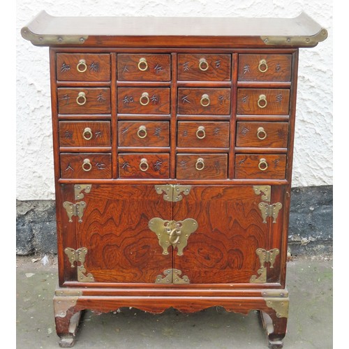 68 - Small early / mid 20th century Oriental oak flight of 16 drawers, with cupboard doors below. Approx.... 