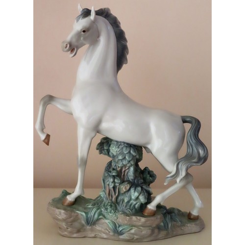 12 - Large Lladro glazed ceramic figure of a Horse. Approx. 44cm H x 34cm W