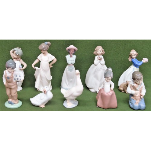 26 - Nine various Nao glazed ceramic figures, plus one Lladro glazed ceramic figure