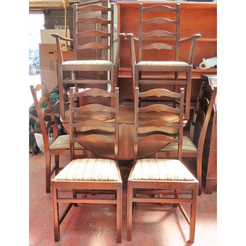 205 - Ercol mid 20th century drop leaf dining table, plus six (4+2) ercol dining chairs