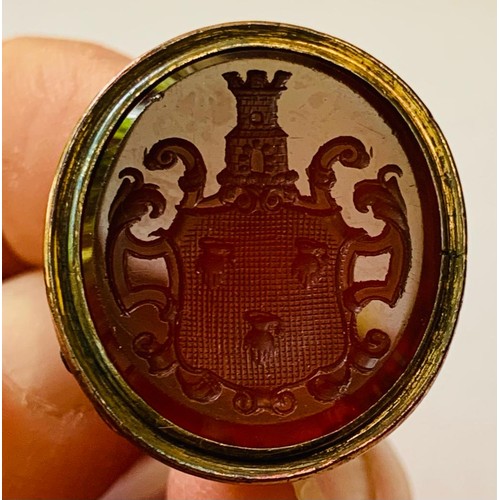 26 - ANTIQUE GOLD COLOURED LARGE CARNELIAN SEAL PENDANT WITH COAT OF ARMS, TOTAL WEIGHT APPROX 11.6g