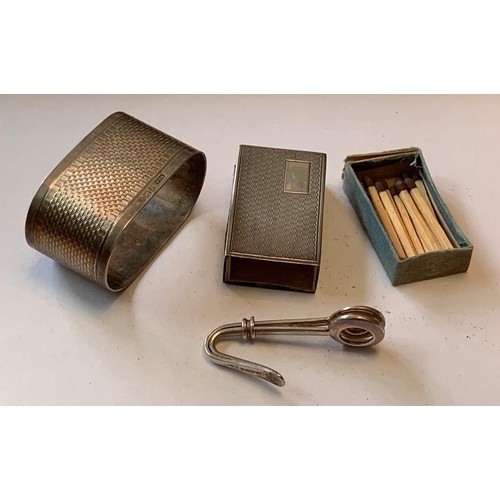 46 - SILVER NAPKIN RING, SILVER NAPKIN CLIP AND SILVER MATCHBOX, TOTAL WEIGHT APPROX 56.32g