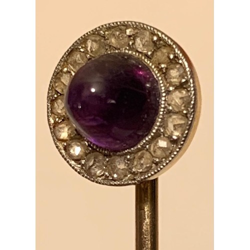 17 - UNMARKED GOLD COLOURED PIN WITH A CABOCHON CUT AMETHYST AND SIXTEEN VERY SMALL DIAMONDS, TOTAL WEIGH... 