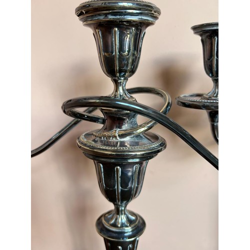 6 - PAIR OF SILVER PLATED TABLE CANDLESTICKS WITH SCROLL ARMS, ON OVAL BASE