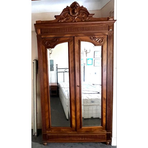 252 - TWO DOOR MIRRORED WALNUT WARDROBE, APPROX 243cm H x 115cm x 42cm