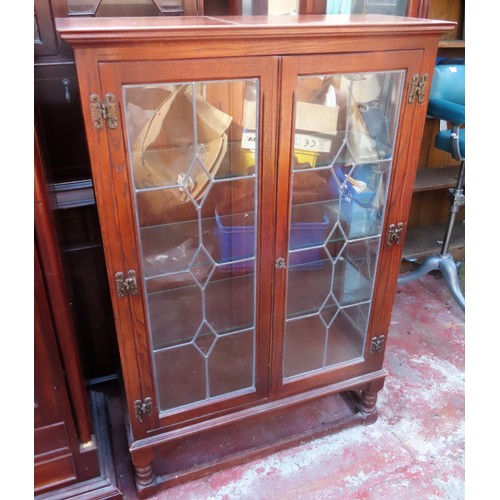 97 - 20th century Oak two door leaded glass display cabinet. Approx. 132cm H x 86cm W 33.5cm D