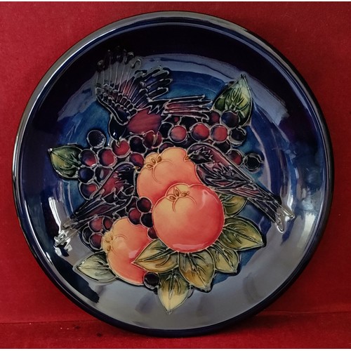 38 - MOORCROFT GLAZED CERAMIC PLATE, DECORATED WITH FINCHES, APPROX. 25.5CM DIAMETER