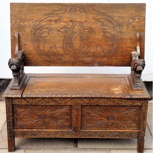 11 - Early 20th century Oak monks bench, with carved decoration. Approx. 104cm H x 106cm W x 48cm D