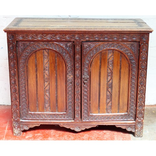 147 - Late 19th century heavily carved oak two door side cabinet. Approx. 80cm H x 97cm W x 41cm D