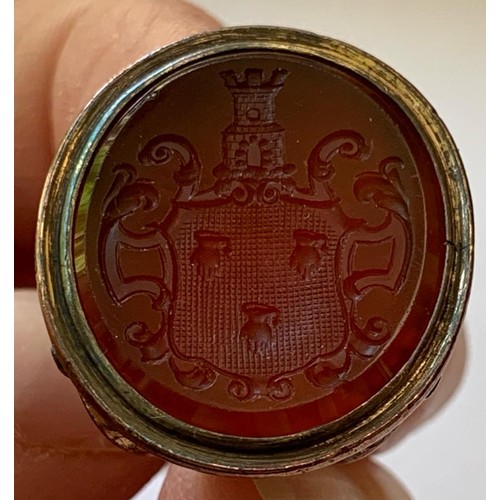 324 - ANTIQUE GOLD COLOURED LARGE CARNELIAN SEAL PENDANT WITH COAT OF ARMS, TOTAL WEIGHT APPROX 11.6g