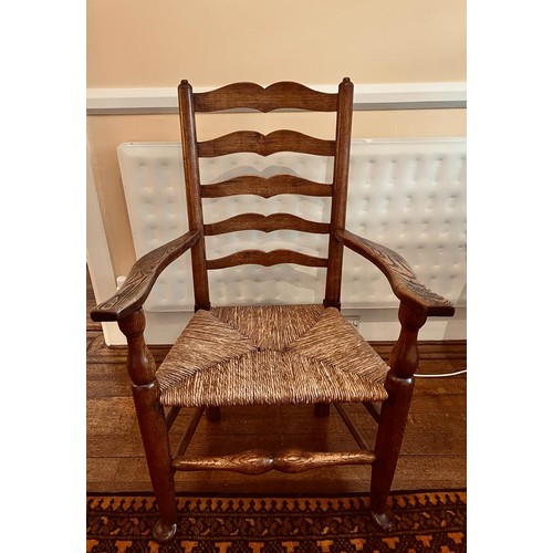 64 - ANTIQUE LADDER BACK ARMCHAIR