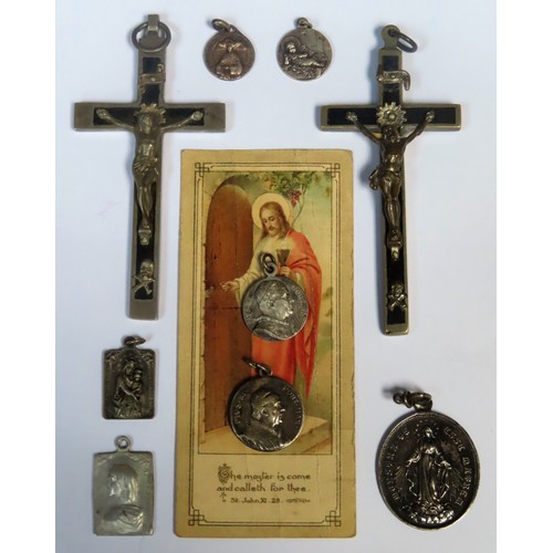 295 - Mixed lot of various religious crosses, silver coloured pendant etc