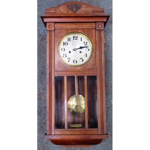 128 - Oak cased wall clock with silver coloured dial. Approx. 79cms H x 37cms W x 19cms D