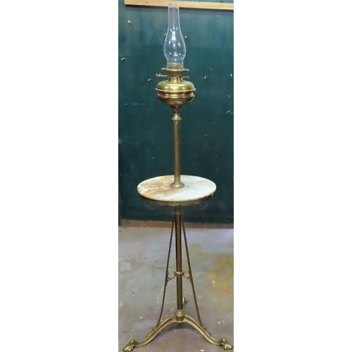 16 - Late 19th/ Early 20th century brass freestanding oil lamp with central marble circular shelf. Approx... 