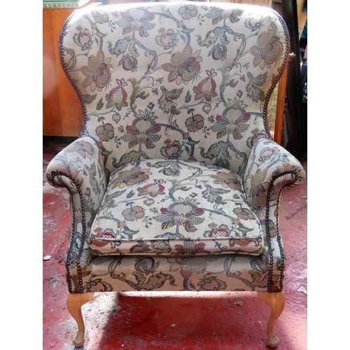 61 - 20th century upholstered wing armchair. Approx. 102cms H x 82cms W x 81cms D