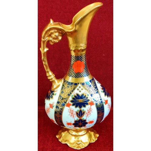 131 - BOXED ROYAL CROWN DERBY OLD IMARI PATTERN GLAZED AND GILDED EWER. APPROX. 26.5CM H