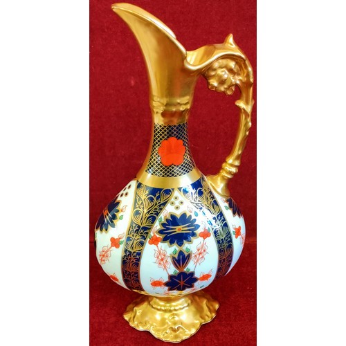 131 - BOXED ROYAL CROWN DERBY OLD IMARI PATTERN GLAZED AND GILDED EWER. APPROX. 26.5CM H