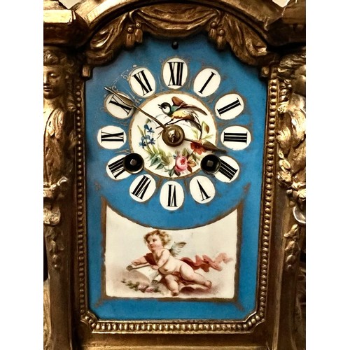 10 - FRENCH GILDED CLOCK AND GARNITURES WITH ENAMEL PANELS DEPICTING CHERUBS, BIRDS AND FLORAL SPRAYS, GA... 