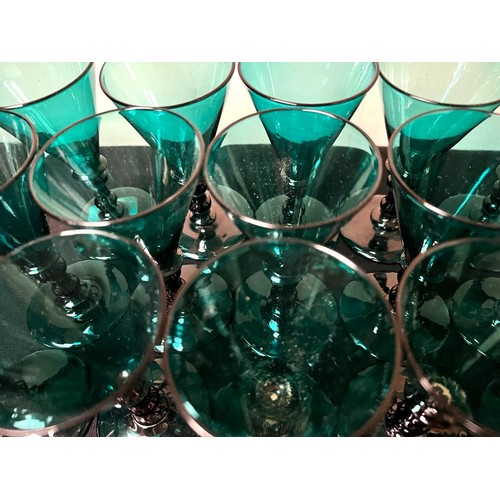 17 - FIFTEEN VICTORIAN DARK GREEN WINE GLASSES, NEAR MATCHING